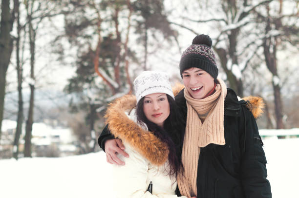 istock happy young people in winter park 1007179266