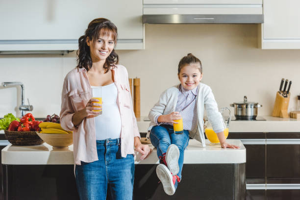 istock mother and daughter with juice 1007182462