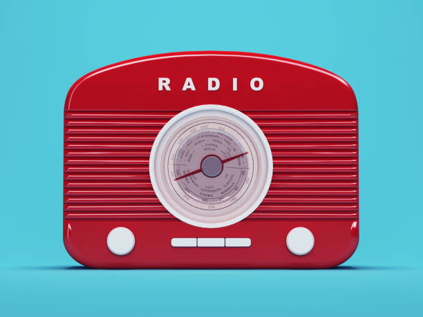 istock Red retro radio standing on blue background 1007189224