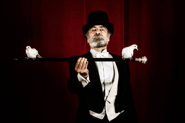 istock Magician holding stick with doves 1007193994