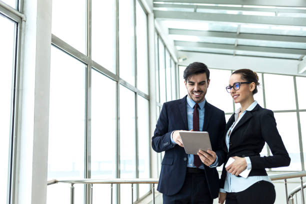 istock Coworkers discussing and planning at work 1007194124