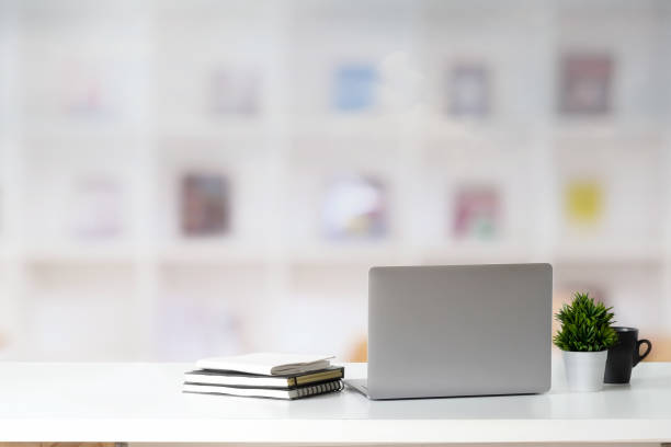 office desk with laptop. - book school desk old imagens e fotografias de stock