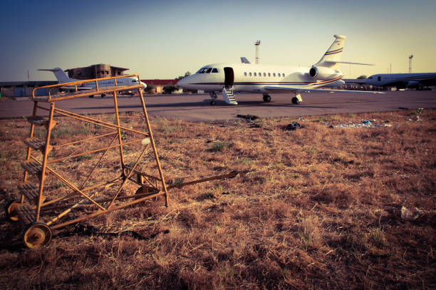 Falcon 2000 Business Jet in N'Djamena, Chad, surrounded by the general chaos and poverty Africa is known for. The risk of FOD (Foreign Object Damage) is immense.