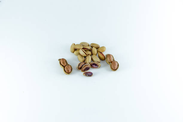 istock roasted and salted pistachios in shell  on isolated white background 1007195528