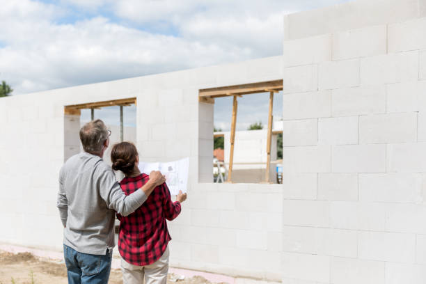 istock Couple on construction site of new house 1007197920