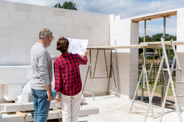istock Couple on construction site of new house 1007198144