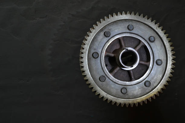Gear on a black background. Free space for text.