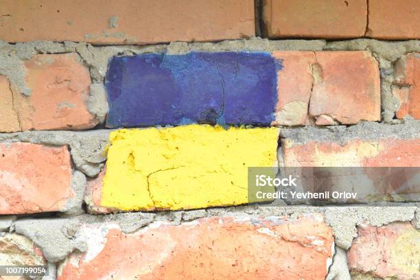 Flag Of Ukraine On A Brick Wall Stock Photo - Download Image Now - Abstract, Aggression, Blue