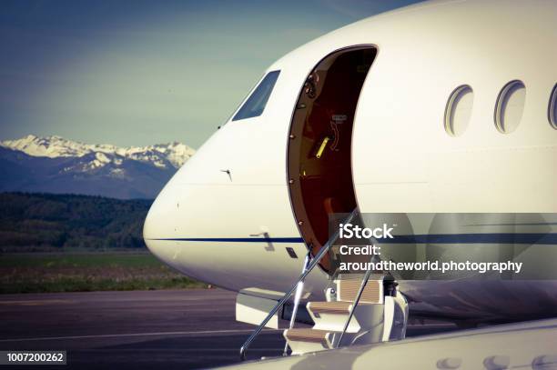 Falcon Business Jet Waiting For Customers Stock Photo - Download Image Now - Corporate Jet, Vehicle Door, Commercial Airplane