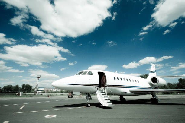 Falcon Business Jet Ready to Go A Falcon 2000 Business Jet is fully prepared and waiting for passengers in St. Petersburg, Russia. flight of steps stock pictures, royalty-free photos & images