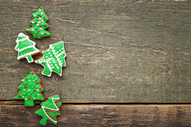 Christmas gingerbread cookies on grey wooden table