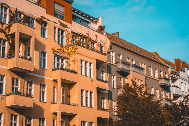 istock orange apartment houses with tree in the foreground 1007211142