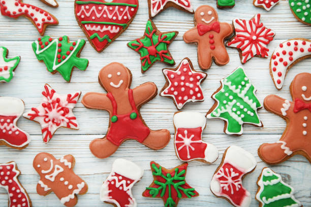 istock Christmas gingerbread cookies on white wooden table 1007211298