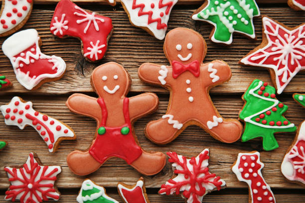 istock Christmas gingerbread cookies on brown wooden table 1007214162