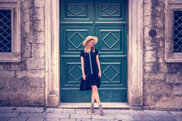 istock Young attractive woman poses  in front of wall 1007214176