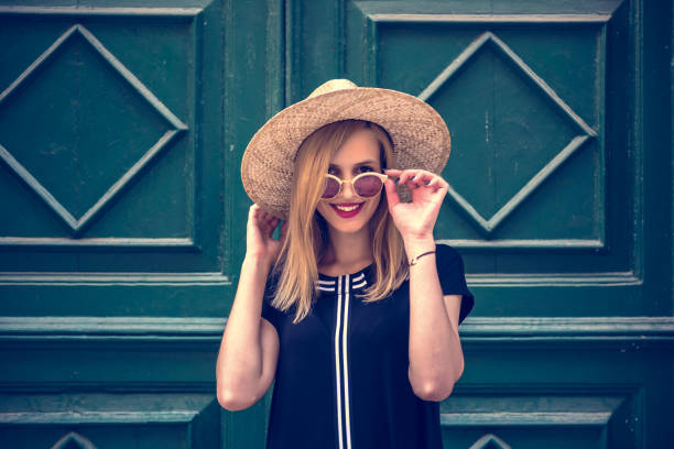 istock Young attractive woman poses  in front of wall 1007214314