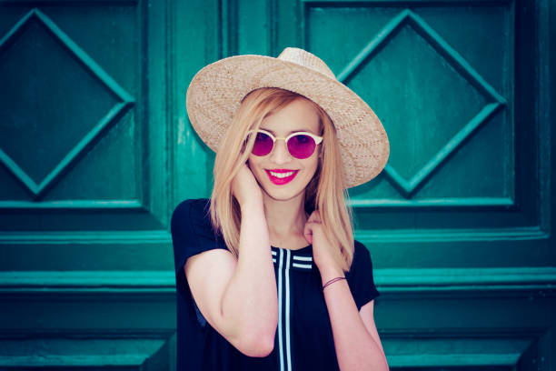 istock Young attractive woman poses  in front of wall 1007214954