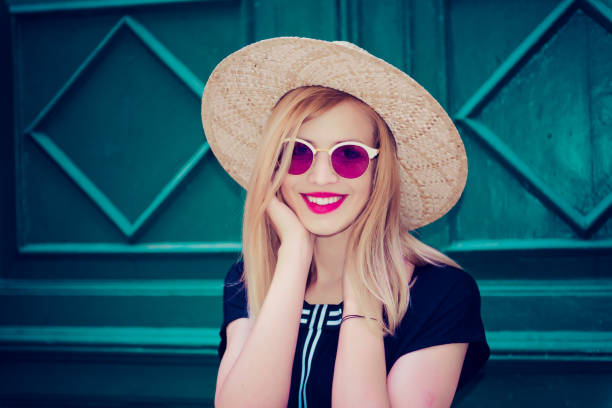 istock Young attractive woman poses  in front of wall 1007215268