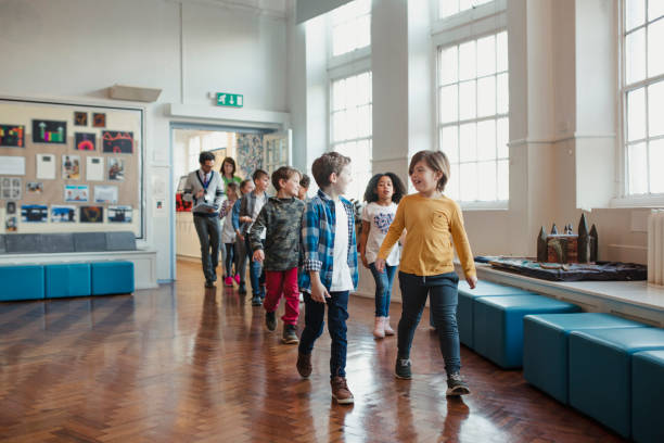 Elementary School Children Walking Through the Hall