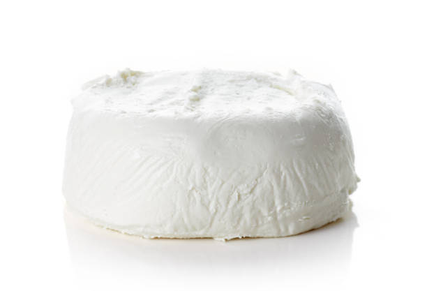 Goat cheese isolated on white Goat cheese isolated on white background cheese goat cheese gourmet food stock pictures, royalty-free photos & images