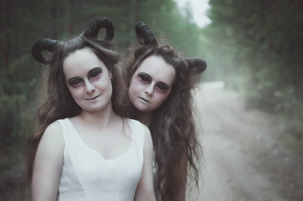 istock Two twins demons with horns in forest 1007231442