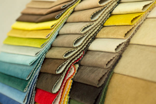 istock Catalog of multicolored cloth from matting fabric texture background, silk fabric texture, textile industry background 1007235582