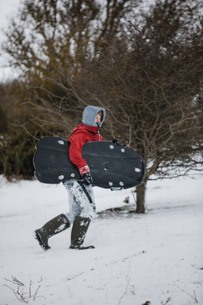 istock Teenage Boy Carrying a Body Board 1007236244