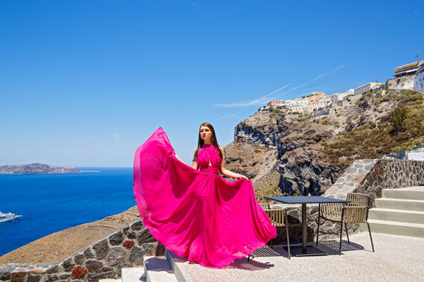 istock Young woman in red dress 1007246556