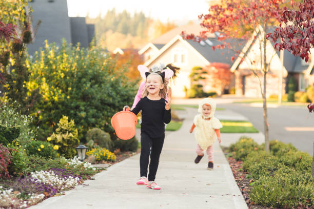 istock Multiethnic group of kids trick or treating 1007254516