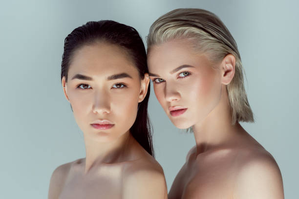 istock beautiful nude multiethnic women, isolated on grey 1007257768