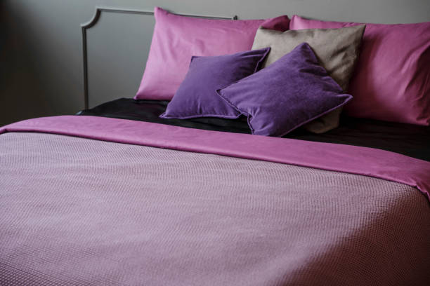 istock Pink and violet bedroom interior 1007258098
