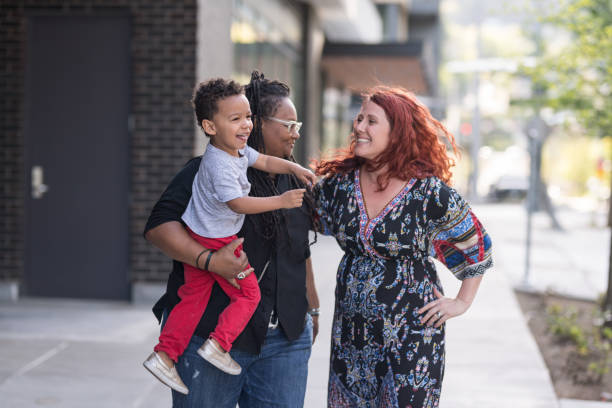 istock Female couple walking with their son 1007261950
