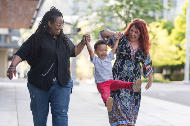 istock Female couple walking with their son 1007261954