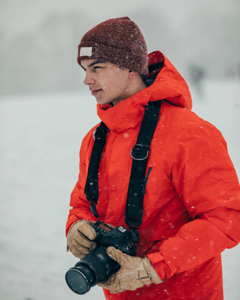 istock Young Professional Photographer In The Snow 1007263048