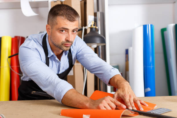 istock serious designer man works colored paper 1007263050