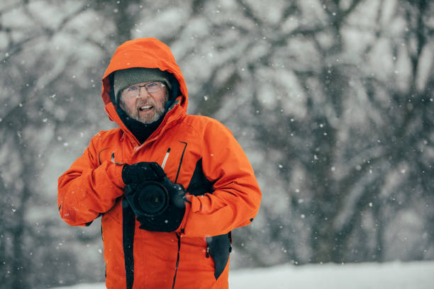istock Senior Photographer In The Snow 1007263150