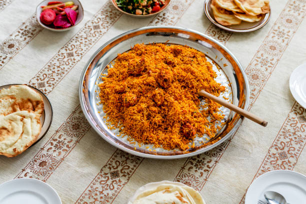 istock Muslim family having dinner on the floor 1007274118