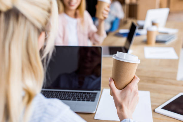 istock cropped image of colleagues working on startup project in office with coffee and gadgets 1007294312