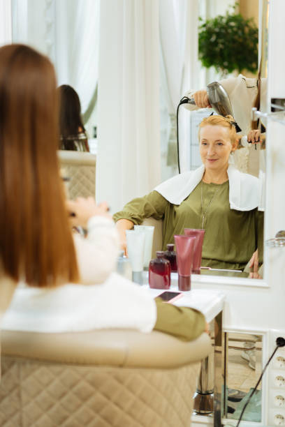 istock Positive joyful woman looking at her reflection 1007294830