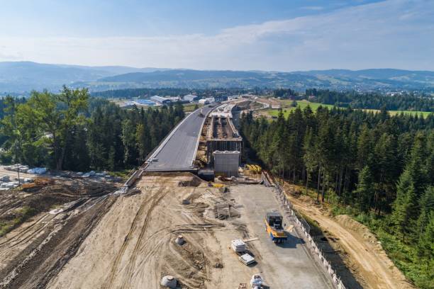 Aerial drone view on road under construction. Aerial drone view on road under construction. Construction of the viaduct on the national road number 7 in Poland road construction photos stock pictures, royalty-free photos & images