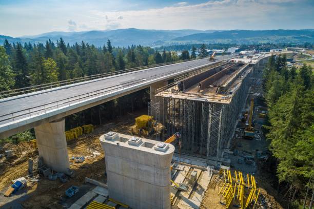 istock Aerial drone view on highway road under construction. 1007302316