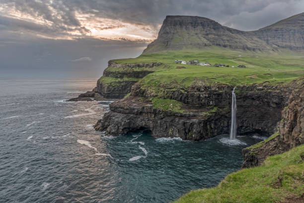 istock Mulafossur in Faroe Islands at Gassadalur 1007304742
