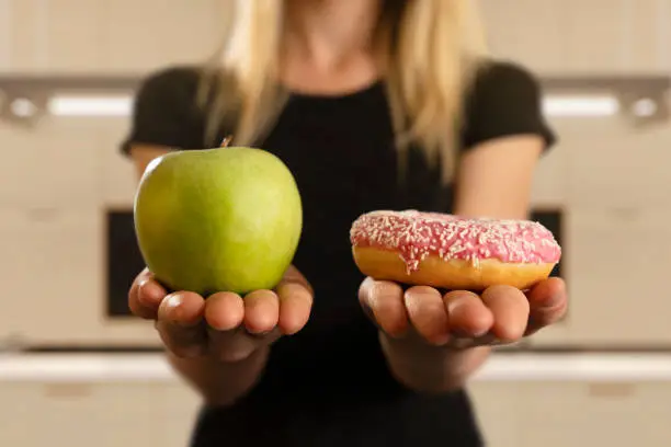 Photo of Choosing Between Donut And Apple