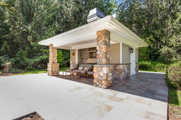 Chic outdoor kitchen space with stone columns stock photo