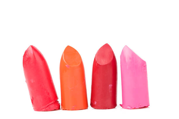 istock Close up of four slices lipstick on white background 1007310758