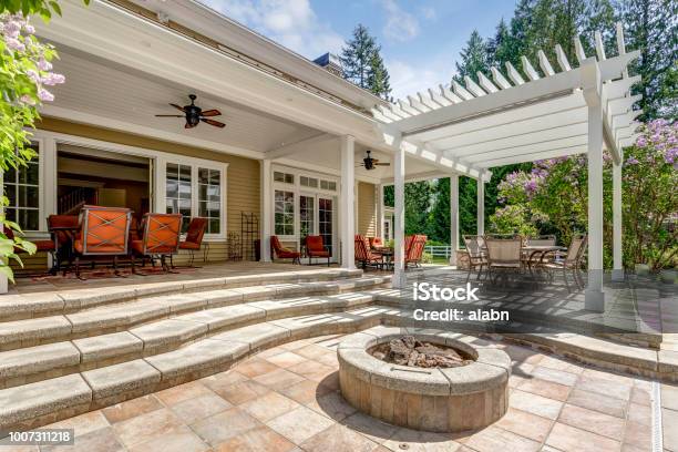 Lovely Outdoor Deck Patio Space With White Dining Pergola Stock Photo - Download Image Now