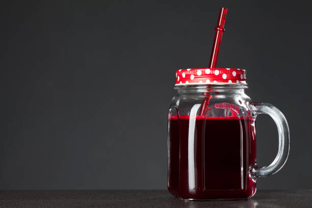 istock red juice in glass jar 1007311568