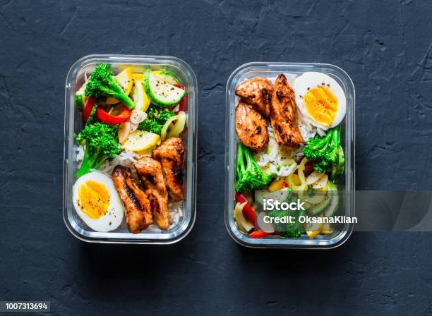 Rice Stewed Vegetables Egg Teriyaki Chicken Healthy Balanced Lunch Box On A Dark Background Top View Home Food For Office Concept Stock Photo - Download Image Now