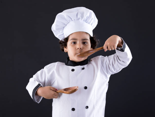 istock Little chef tasting food 1007318162