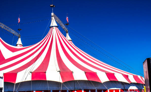 Top Of Big Top Circus Tent Top Of Red & White Striped Big Top Circus Tent circus photos stock pictures, royalty-free photos & images